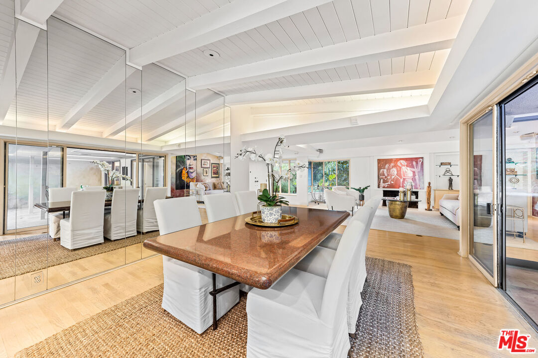 10871 Chalon Road Los Angeles, CA 90077 - Photo 16 of 41 a view of a dining hall with many windows