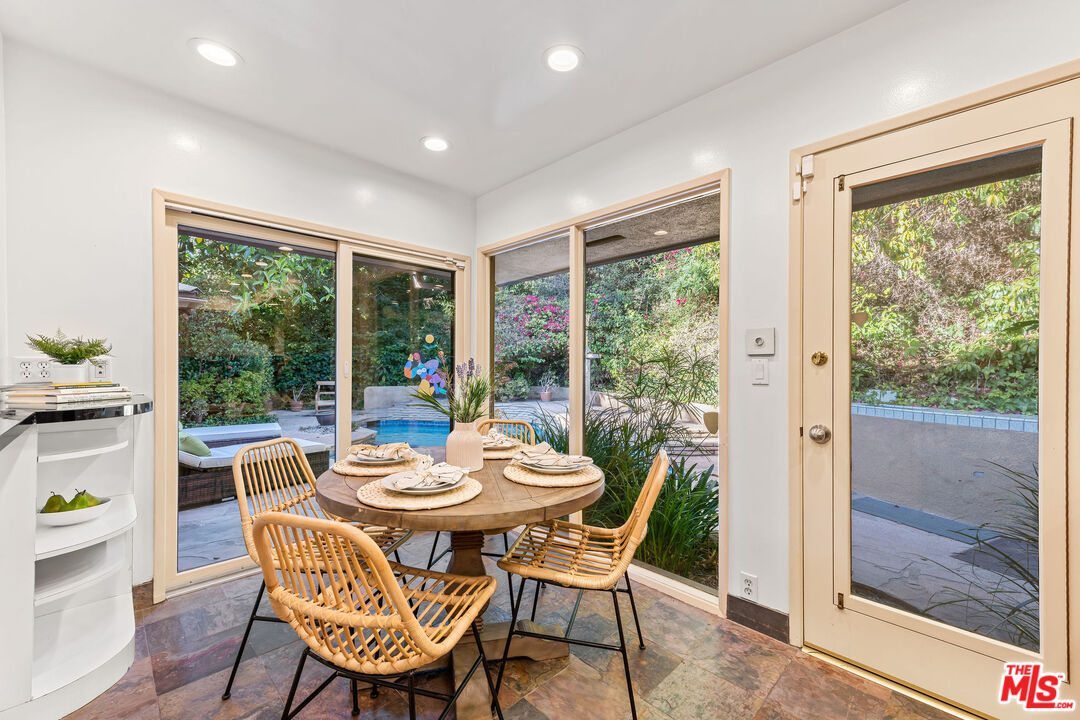 10871 Chalon Road Los Angeles, CA 90077 - Photo 17 of 41 a view of a dining room with furniture window and outside view