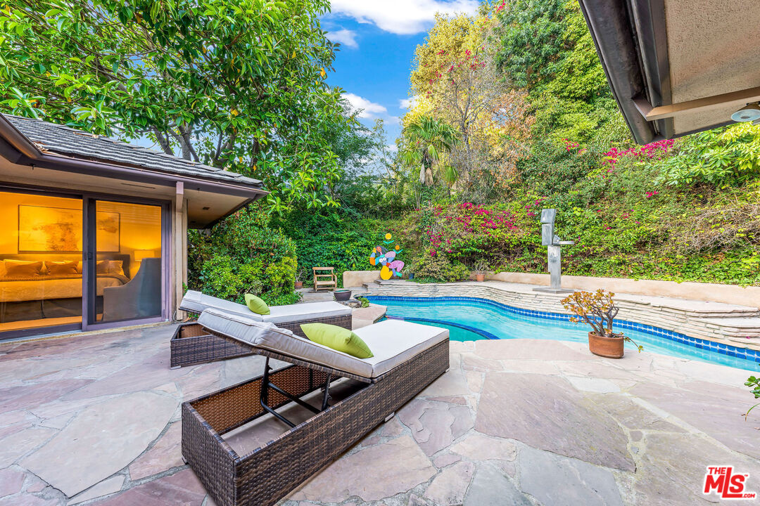 10871 Chalon Road Los Angeles, CA 90077 - Photo 22 of 41 swimming pool with outdoor seating
