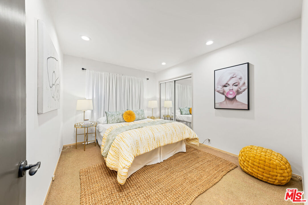 10871 Chalon Road Los Angeles, CA 90077 - Photo 27 of 41 a bedroom with a bed and a lamp