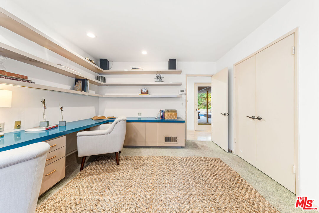 10871 Chalon Road Los Angeles, CA 90077 - Photo 31 of 41 a room with a white walls and white cabinets