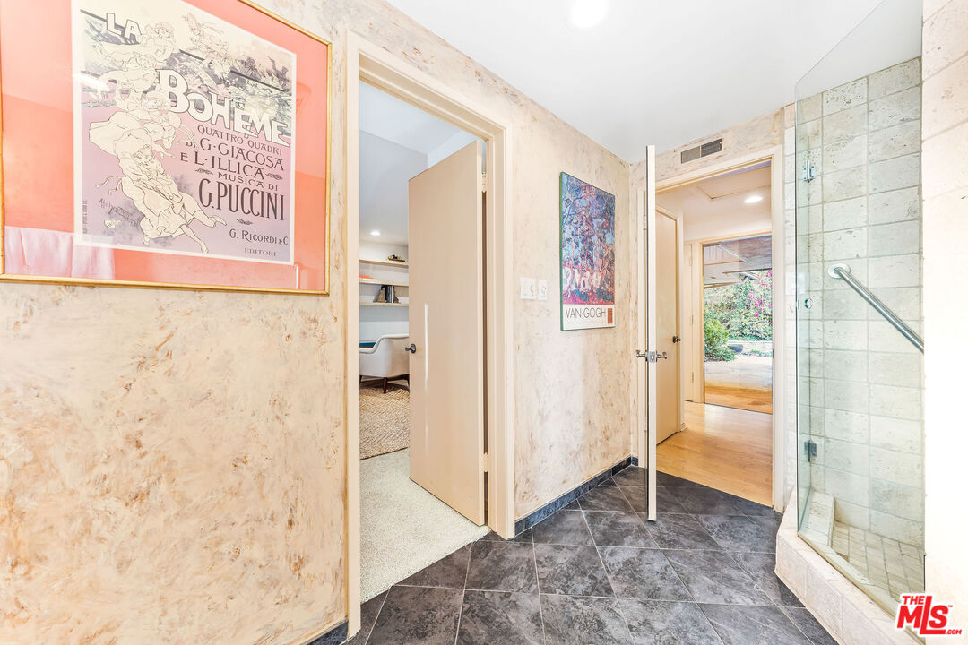 10871 Chalon Road Los Angeles, CA 90077 - Photo 32 of 41 a view of a bathroom with a shower