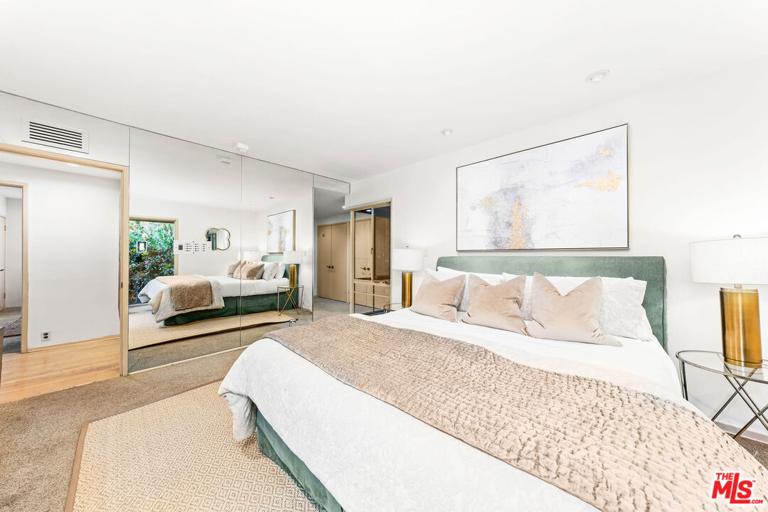 10871 Chalon Road Los Angeles, CA 90077 - Photo 35 of 41 a bedroom with a bed and a couch