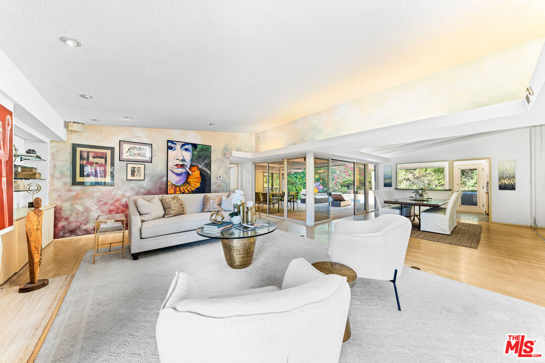 10871 Chalon Road Los Angeles, CA 90077 - Photo 9 of 41 a living room with furniture and a large window