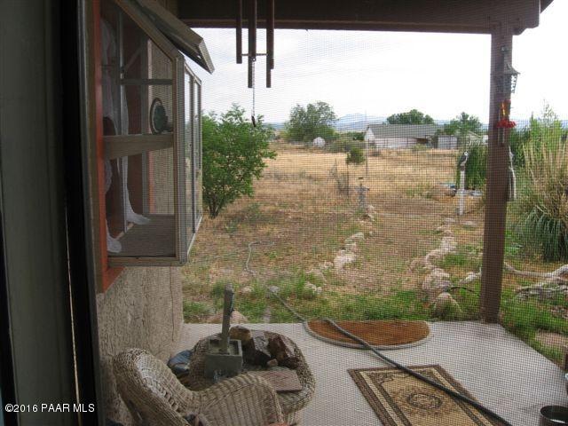 543 West Ahonen Road Paulden, AZ 86334 - Photo 18 of 24 a balcony with table and chairs