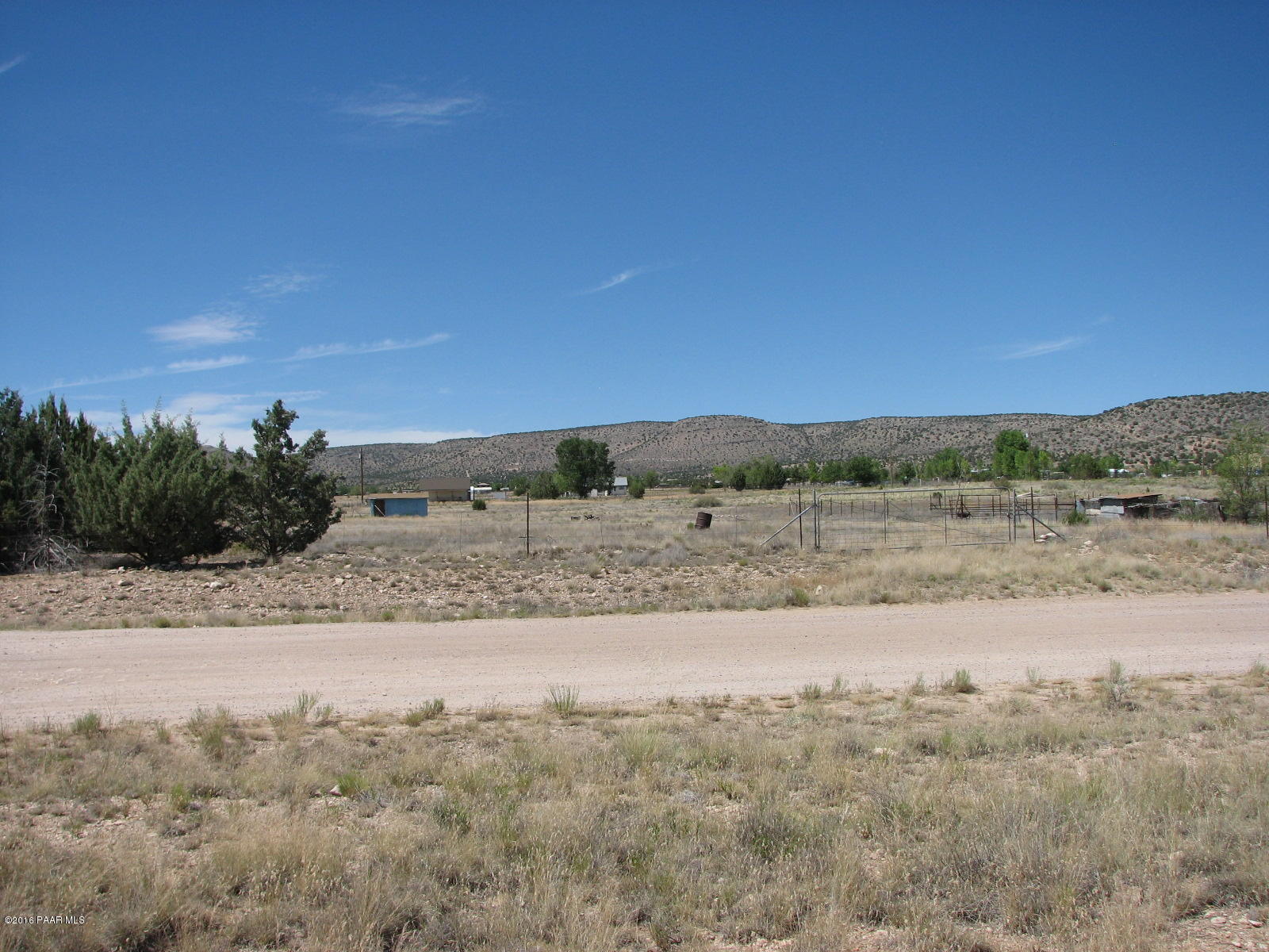 543 West Ahonen Road Paulden, AZ 86334 - Photo 20 of 24 a view of a field with trees in background