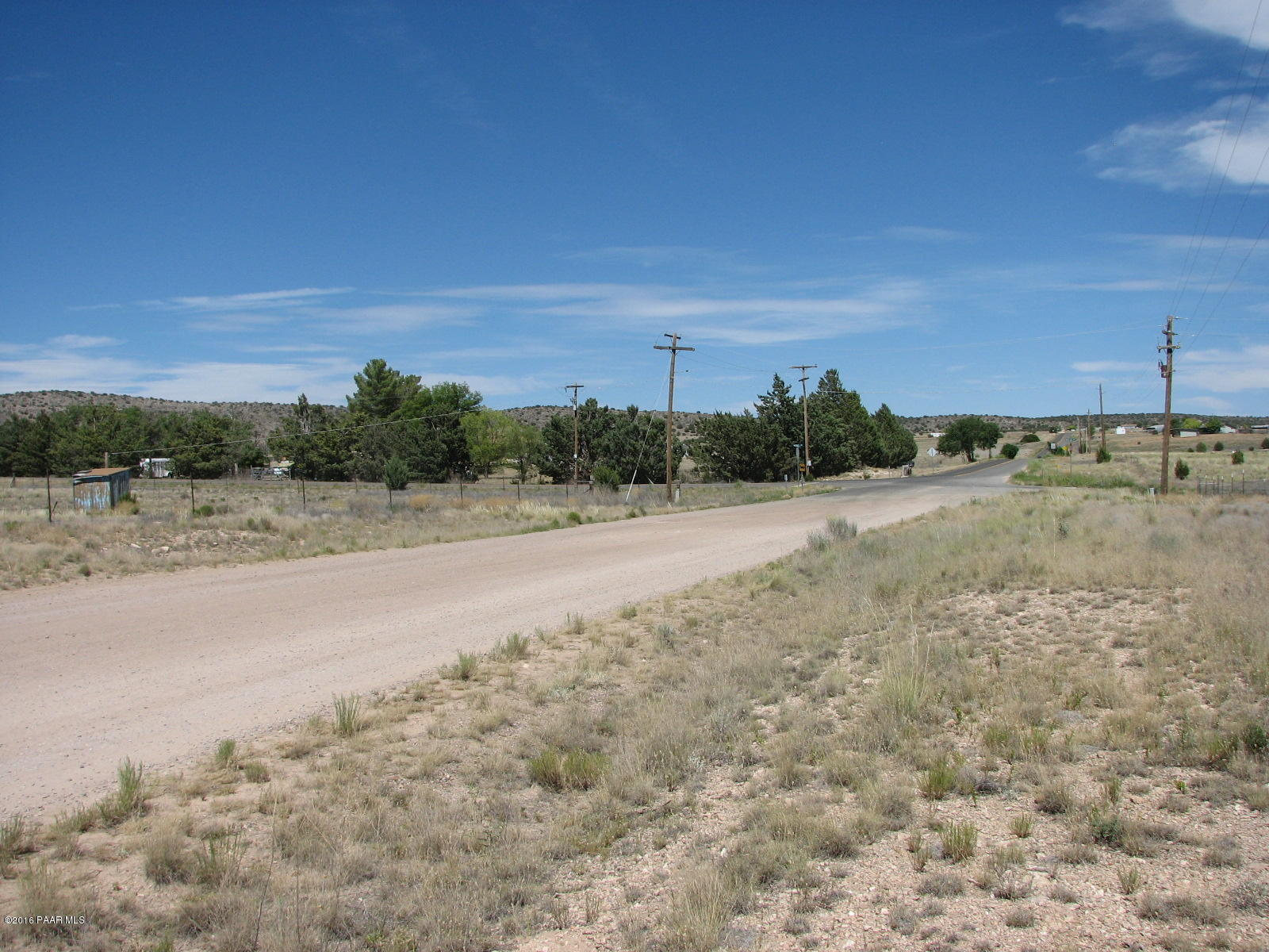 543 West Ahonen Road Paulden, AZ 86334 - Photo 21 of 24 a view of a dry yard with wooden fence
