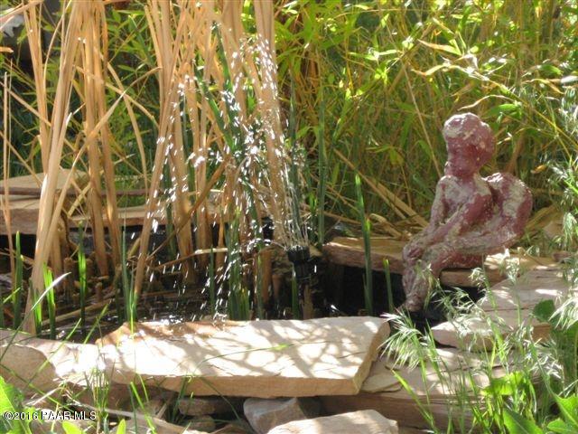 543 West Ahonen Road Paulden, AZ 86334 - Photo 22 of 24 a backyard of a house with a tree