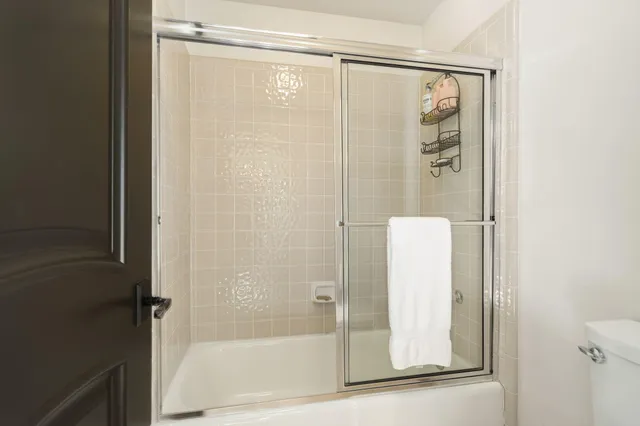 a spacious bedroom with a bed and a couch