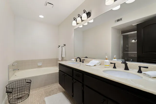 a bathroom with a glass shower door