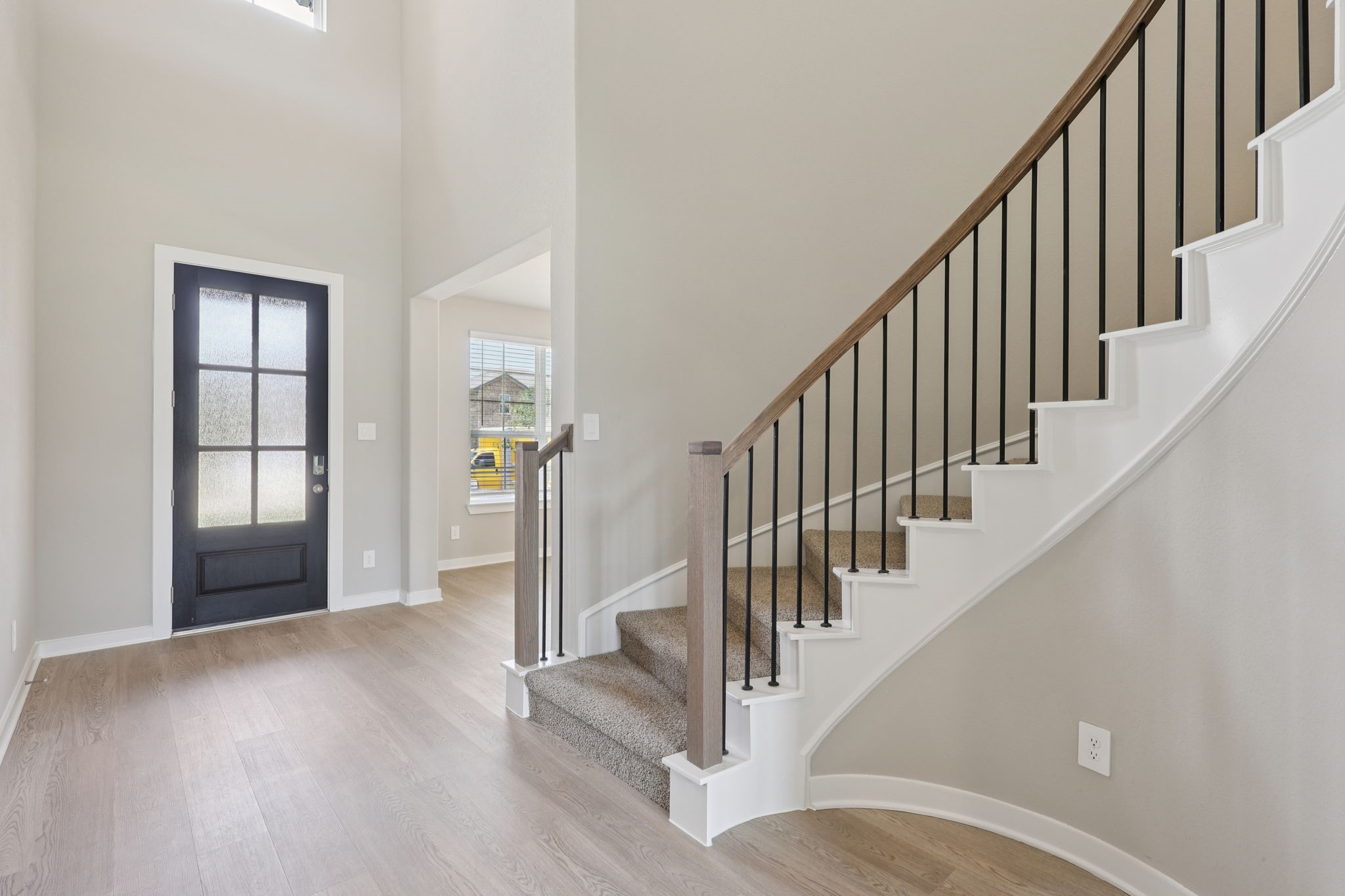 5710 Chamberlain Crossing Rosenberg, TX 77471 - Photo 3 of 40 a view of staircase with wooden floor and staircase