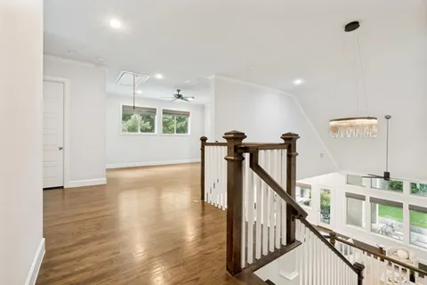 a view of an entryway with wooden floor