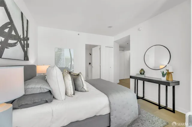 a living room with a bathtub and chandelier