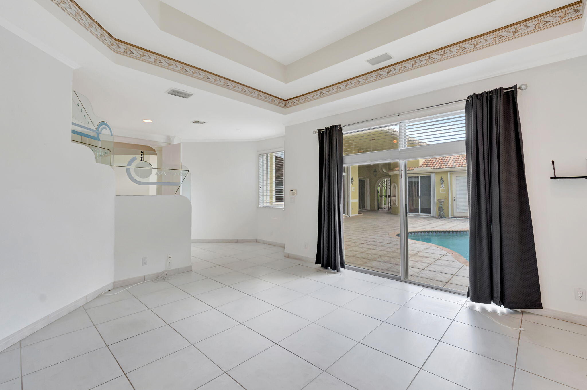 9152 Long Lake Palm Drive Boca Raton, FL 33496 - Photo 17 of 36 a view of an empty room and window