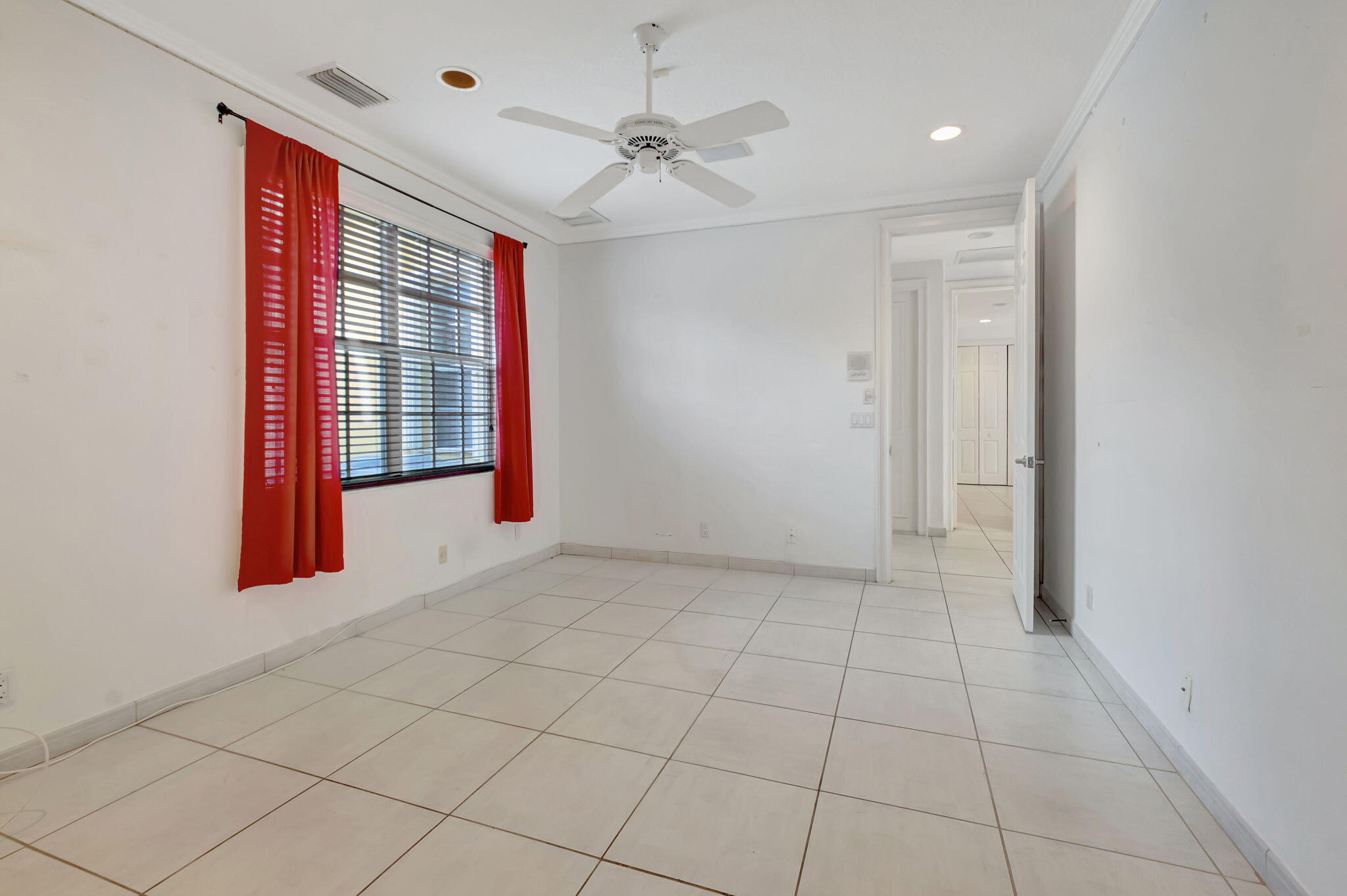 9152 Long Lake Palm Drive Boca Raton, FL 33496 - Photo 20 of 36 a view of an empty room with a window