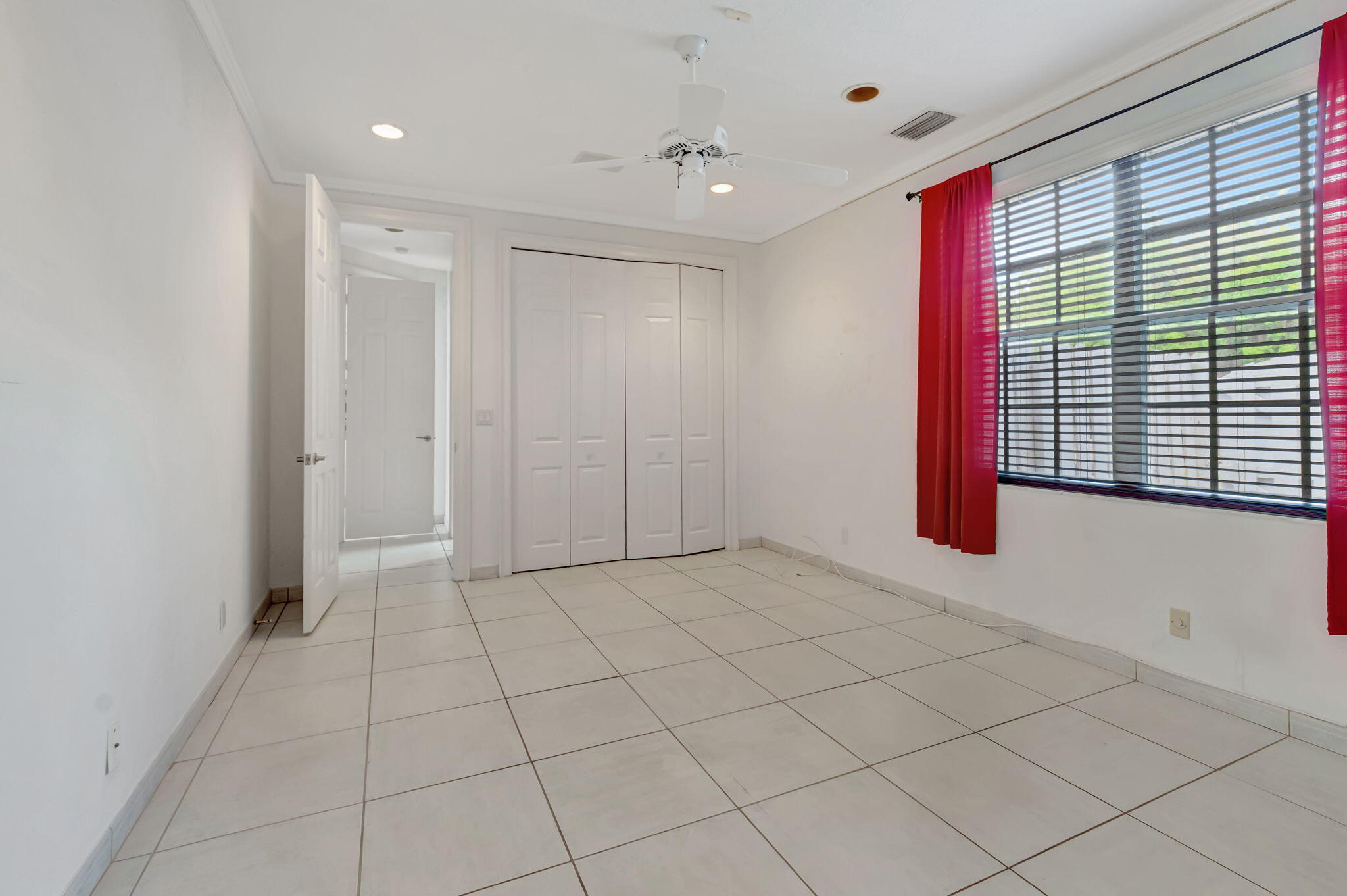 9152 Long Lake Palm Drive Boca Raton, FL 33496 - Photo 21 of 36 a view of an empty room and window