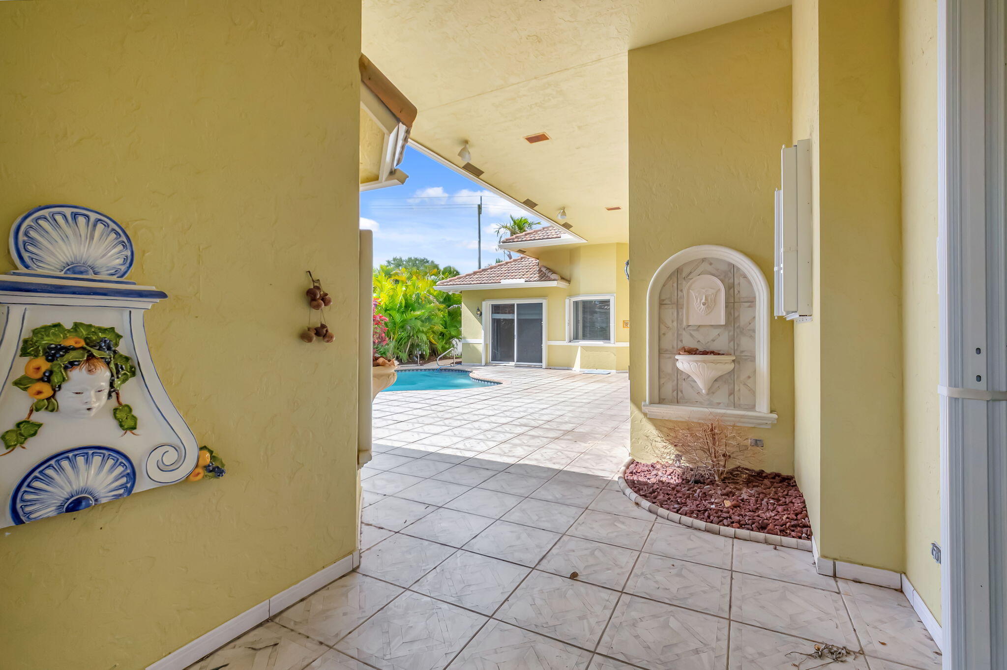 9152 Long Lake Palm Drive Boca Raton, FL 33496 - Photo 26 of 36 a view of a room that has a bed and a table in it