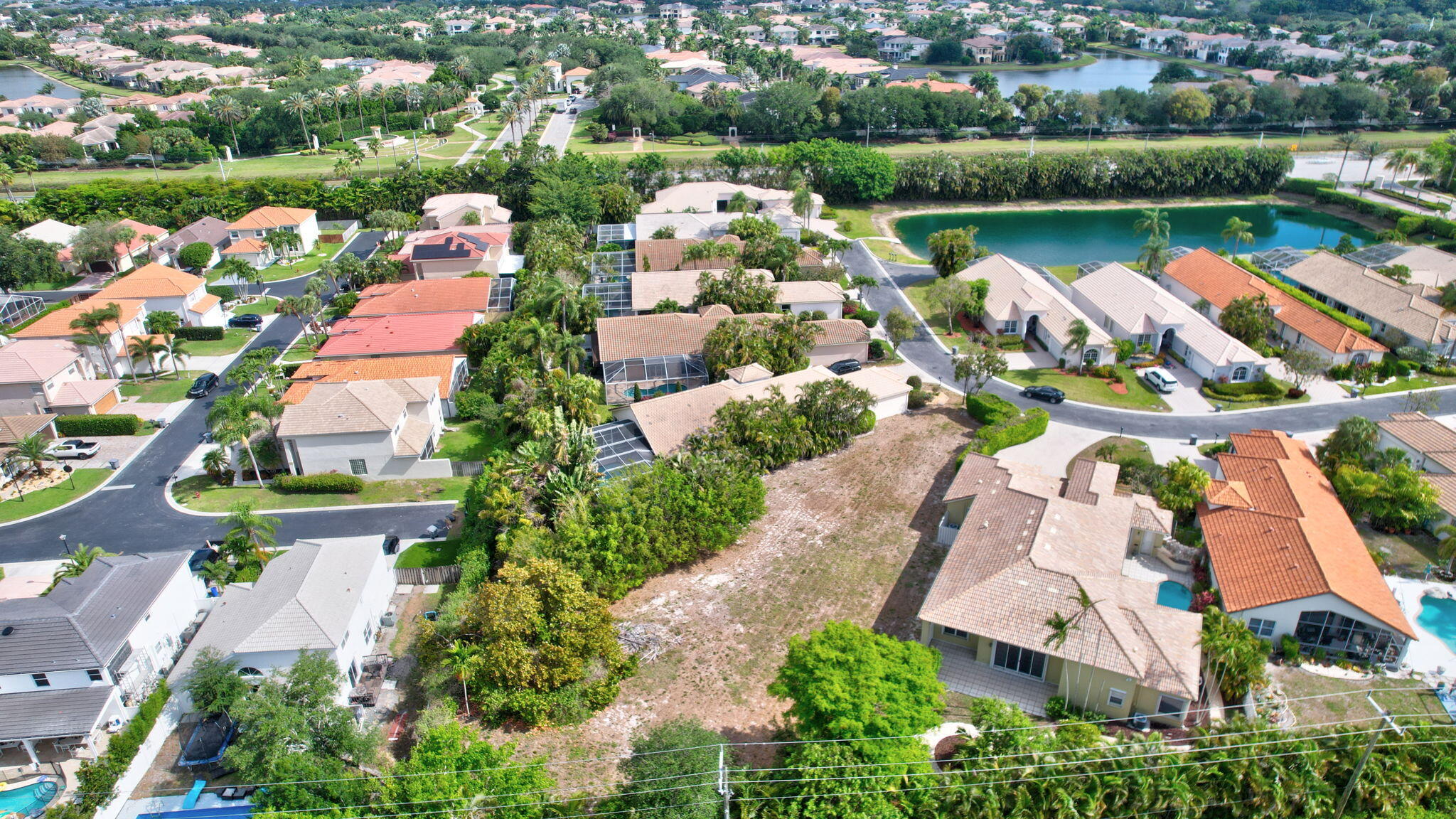 9152 Long Lake Palm Drive Boca Raton, FL 33496 - Photo 34 of 36 an aerial view of residential houses with outdoor space and lake view