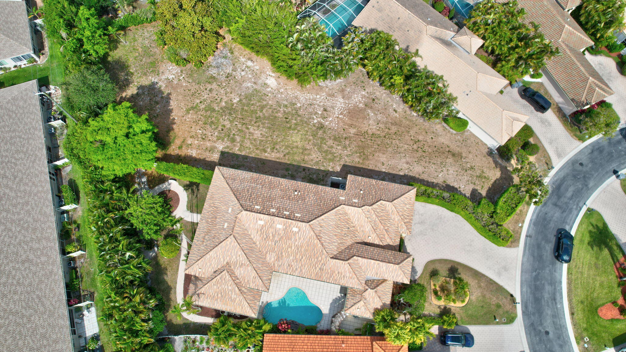 9152 Long Lake Palm Drive Boca Raton, FL 33496 - Photo 35 of 36 an aerial view of a house with a yard and potted plants