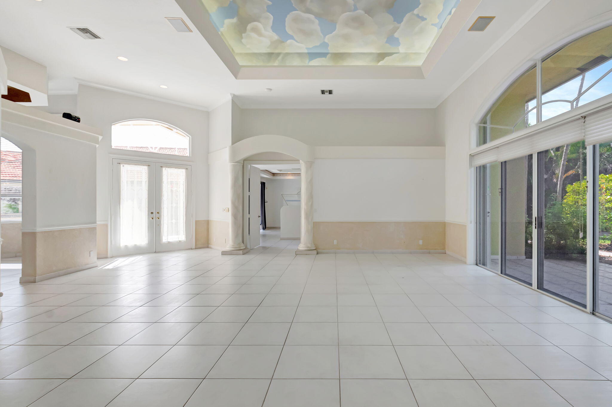 9152 Long Lake Palm Drive Boca Raton, FL 33496 - Photo 4 of 36 a view of an empty room with glass door