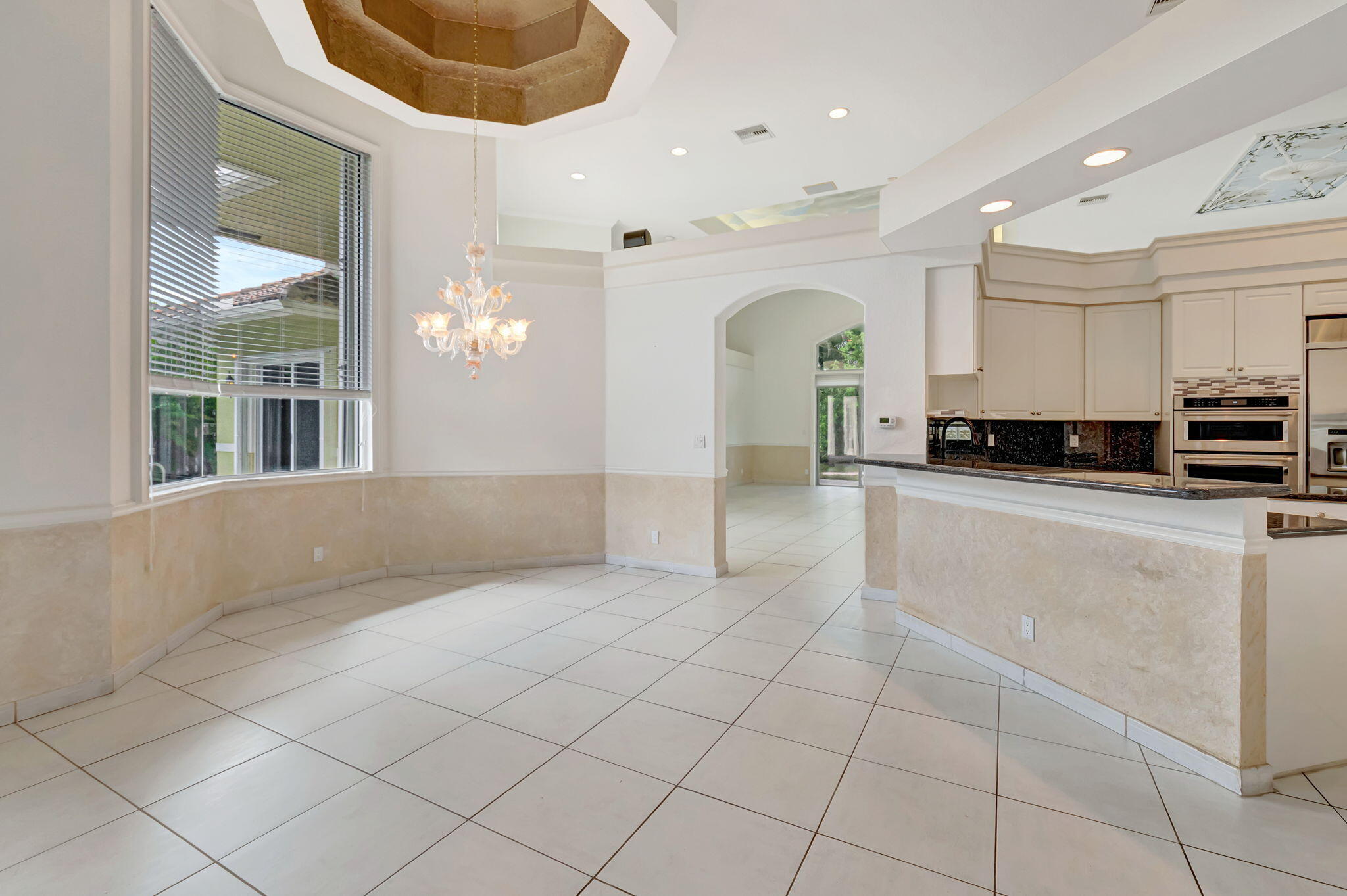 9152 Long Lake Palm Drive Boca Raton, FL 33496 - Photo 7 of 36 a view of a kitchen with electric appliances and cabinets