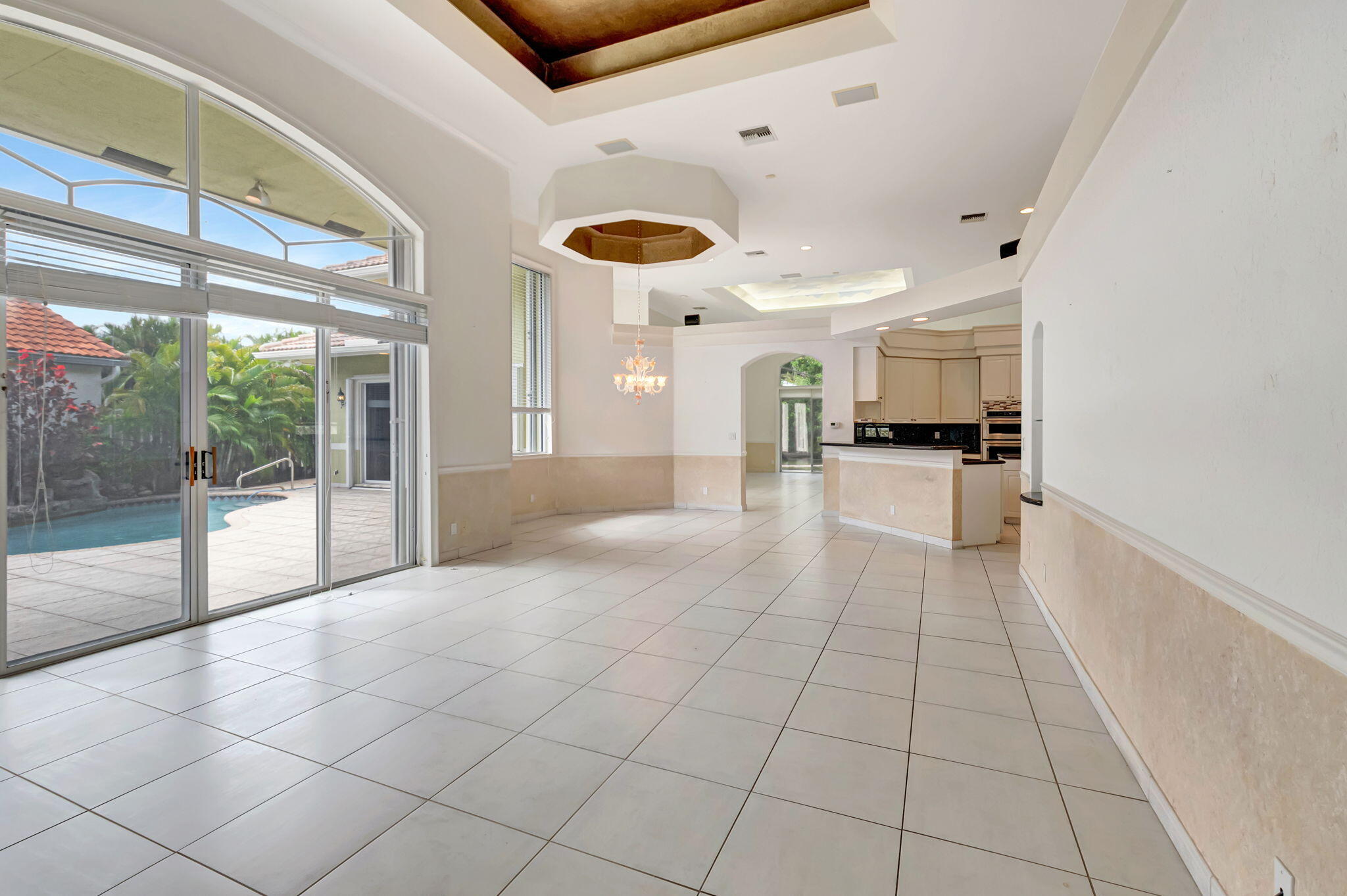 9152 Long Lake Palm Drive Boca Raton, FL 33496 - Photo 9 of 36 a view of a living room with a large window