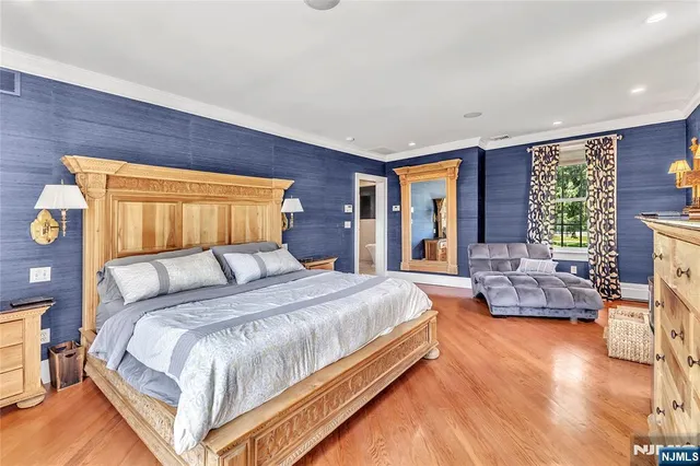 a spacious bedroom with a bed and a couch