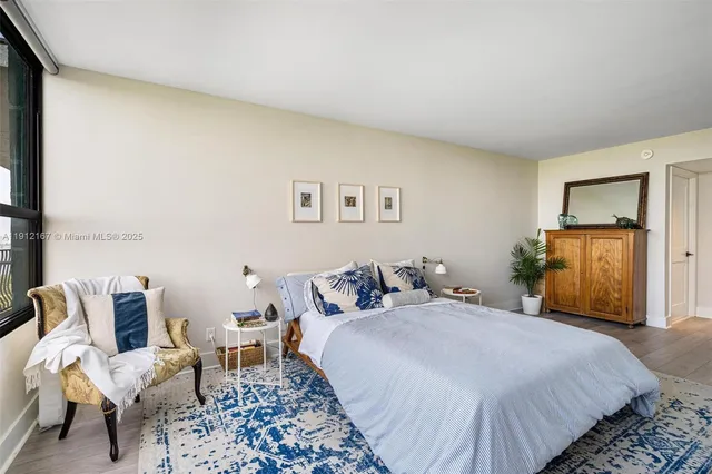 a bathroom with a double vanity sink toilet mirror and bathtub