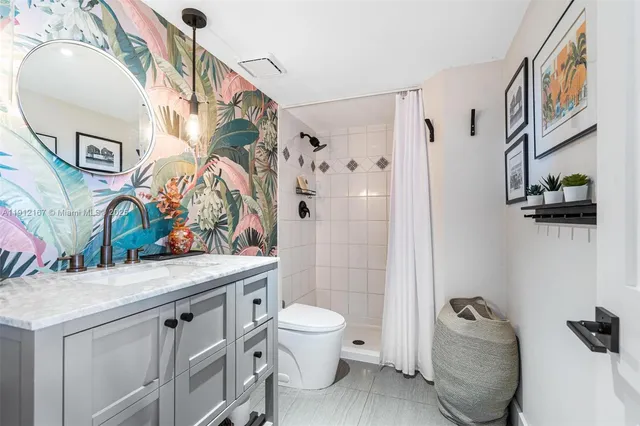 a view of bathroom with dual sinks