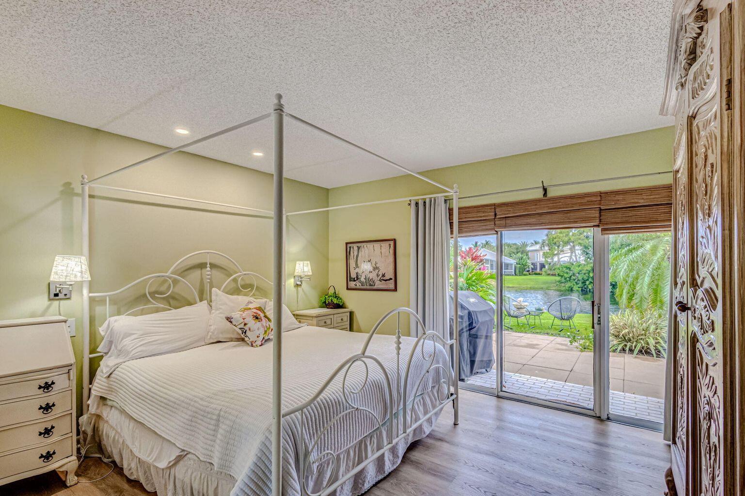 3667 Cape Pointe Circle Jupiter, FL 33477 - Photo 18 of 37 a bedroom with a bed and a window