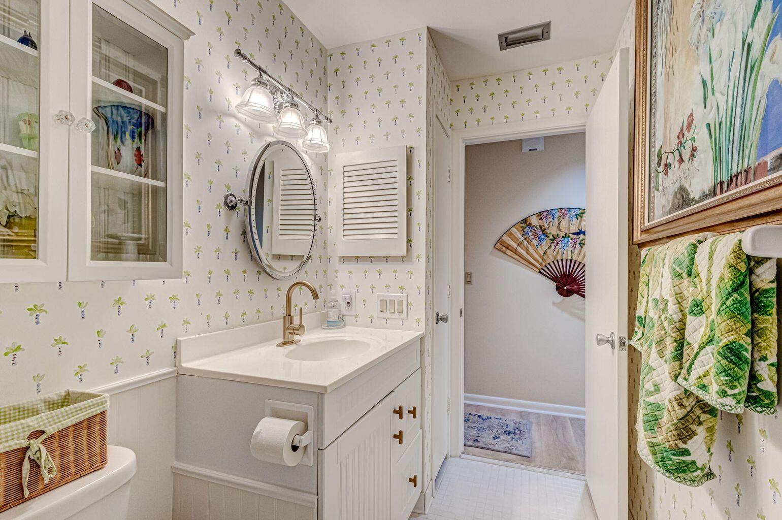 3667 Cape Pointe Circle Jupiter, FL 33477 - Photo 26 of 37 a bathroom with a sink a mirror and a shower curtain