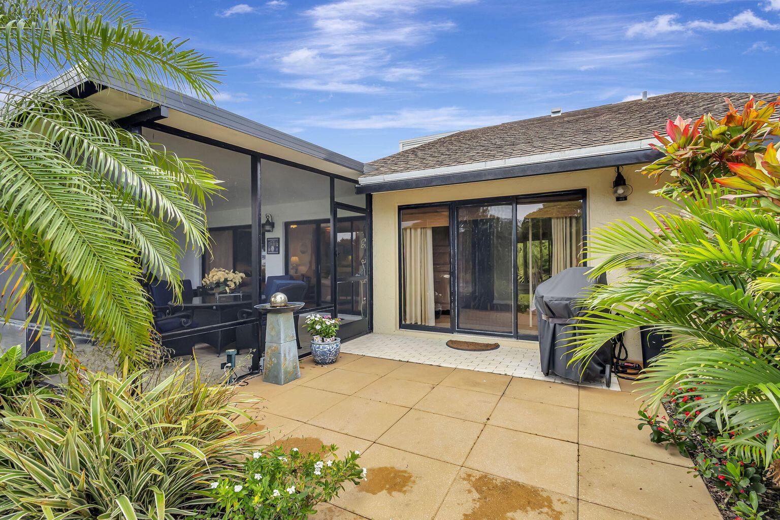 3667 Cape Pointe Circle Jupiter, FL 33477 - Photo 31 of 37 a view of the entryway of the house