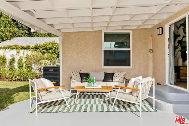 a outdoor space with patio the couches and a potted plant on the table