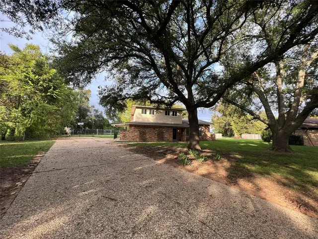 a view of house with yard