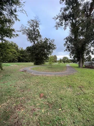 a view of a field with an trees