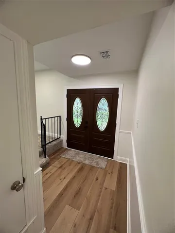 a view of wooden floor with a window