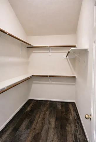 a bathroom with a double vanity sink toilet and mirror