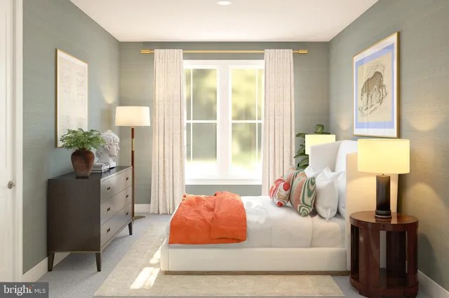 a bedroom with a bed and a lamp