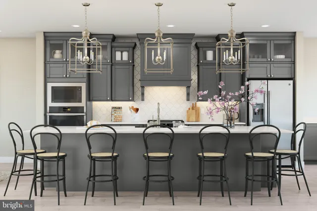 a dining room with furniture and chandelier