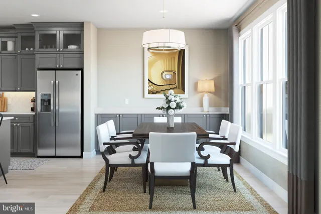 a dining room with furniture and window