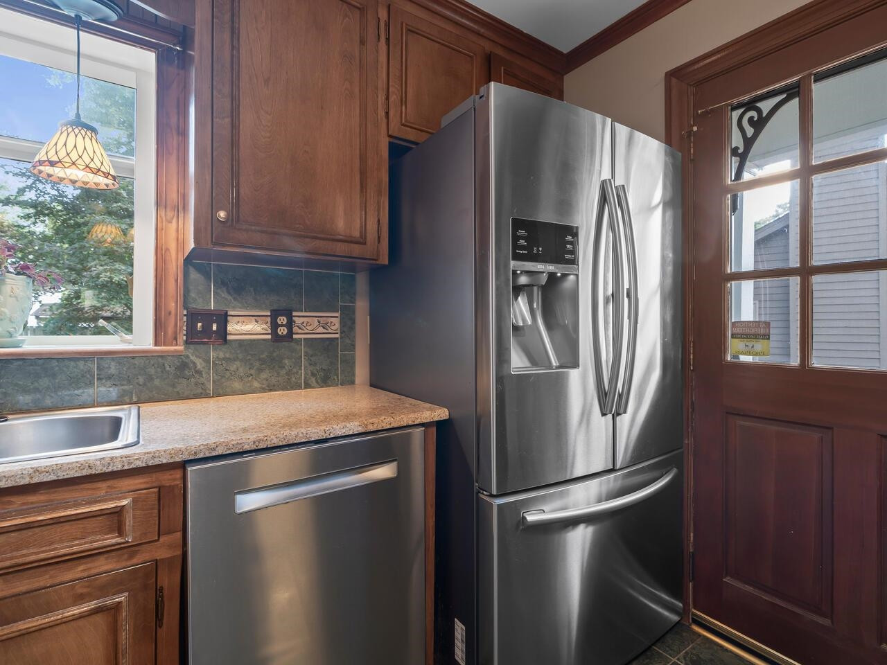 2603 Sawmill Road Raleigh, NC 27613 - Photo 11 of 53 a kitchen with stainless steel appliances granite countertop a refrigerator and a sink