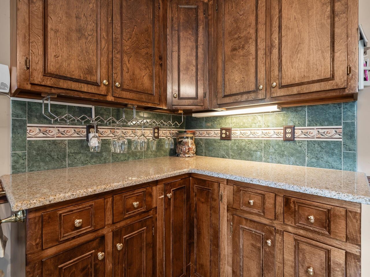 2603 Sawmill Road Raleigh, NC 27613 - Photo 14 of 53 a kitchen with granite countertop wooden cabinets and a counter top