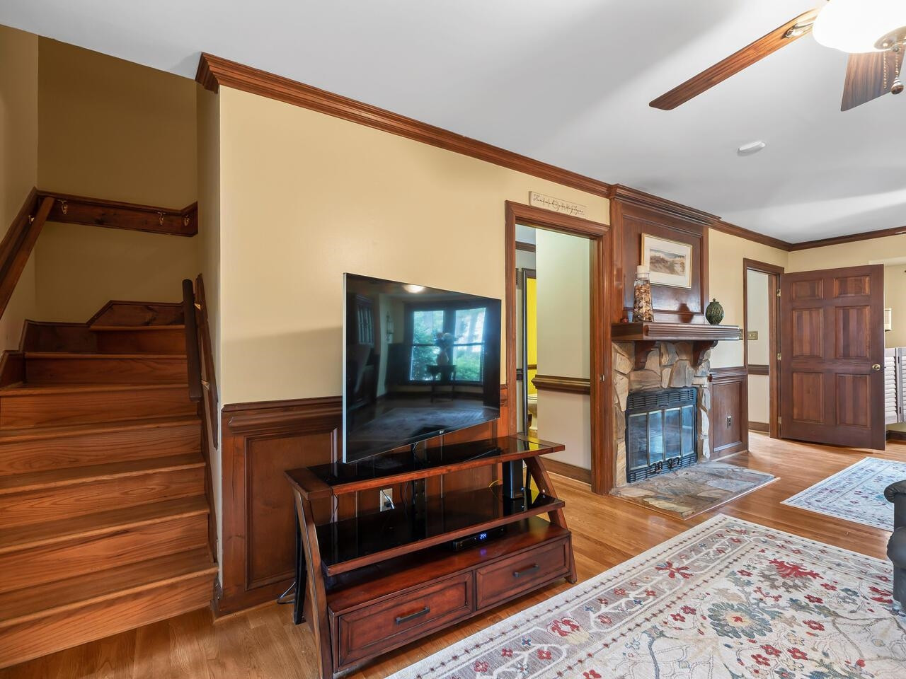 2603 Sawmill Road Raleigh, NC 27613 - Photo 18 of 53 a living room with furniture and a wooden floor