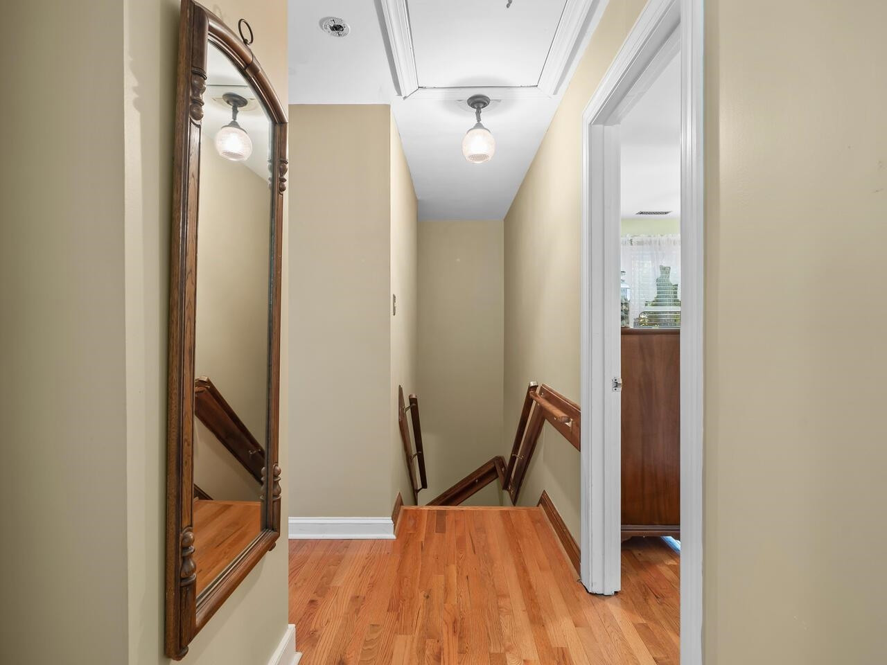 2603 Sawmill Road Raleigh, NC 27613 - Photo 22 of 53 a view of front door with hallway and wooden floor