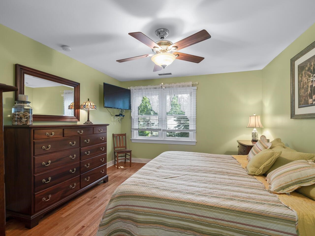 2603 Sawmill Road Raleigh, NC 27613 - Photo 32 of 53 a bedroom with a bed and a large mirror on the dresser