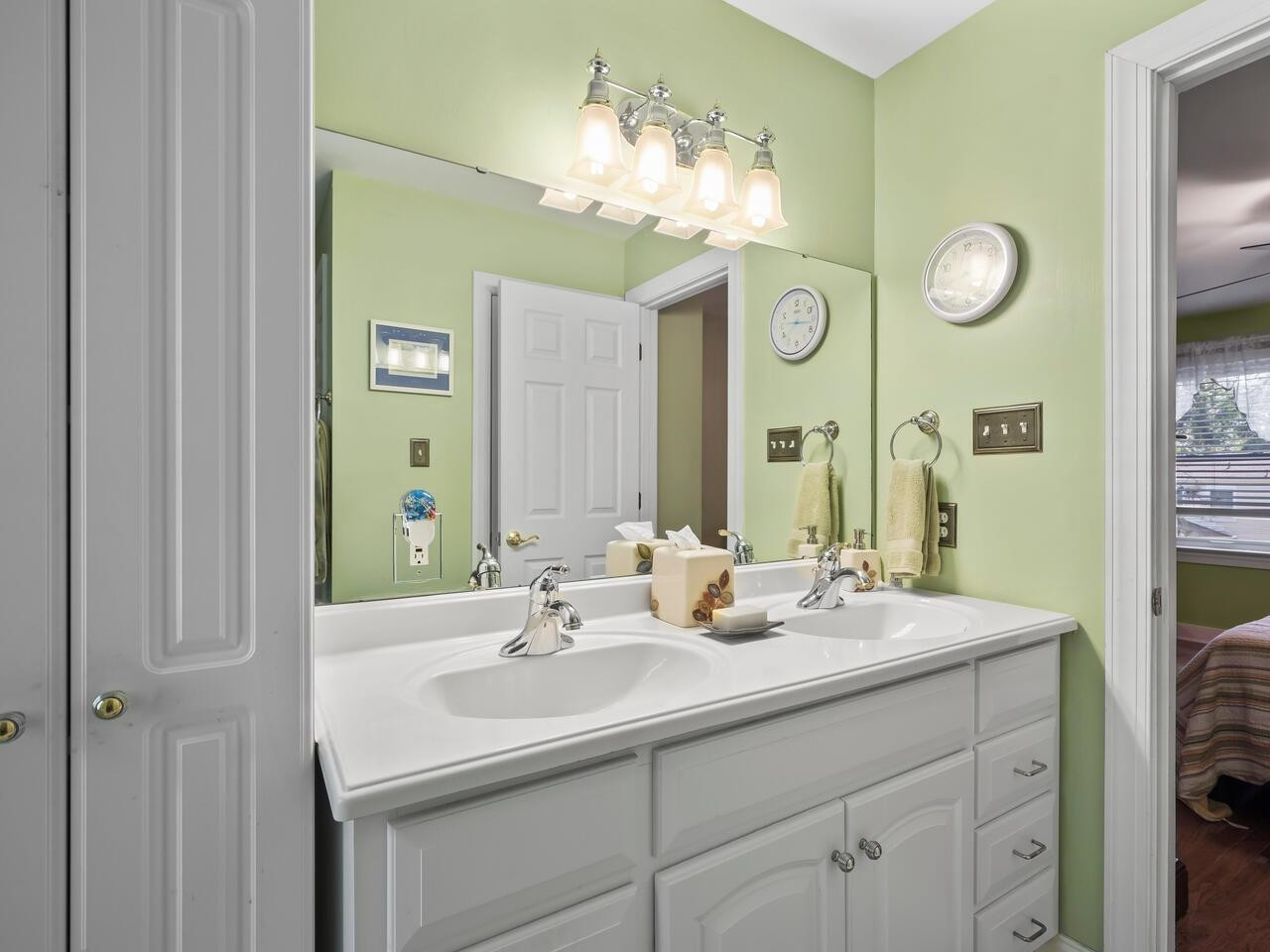2603 Sawmill Road Raleigh, NC 27613 - Photo 34 of 53 a bathroom with a sink double vanity and a mirror