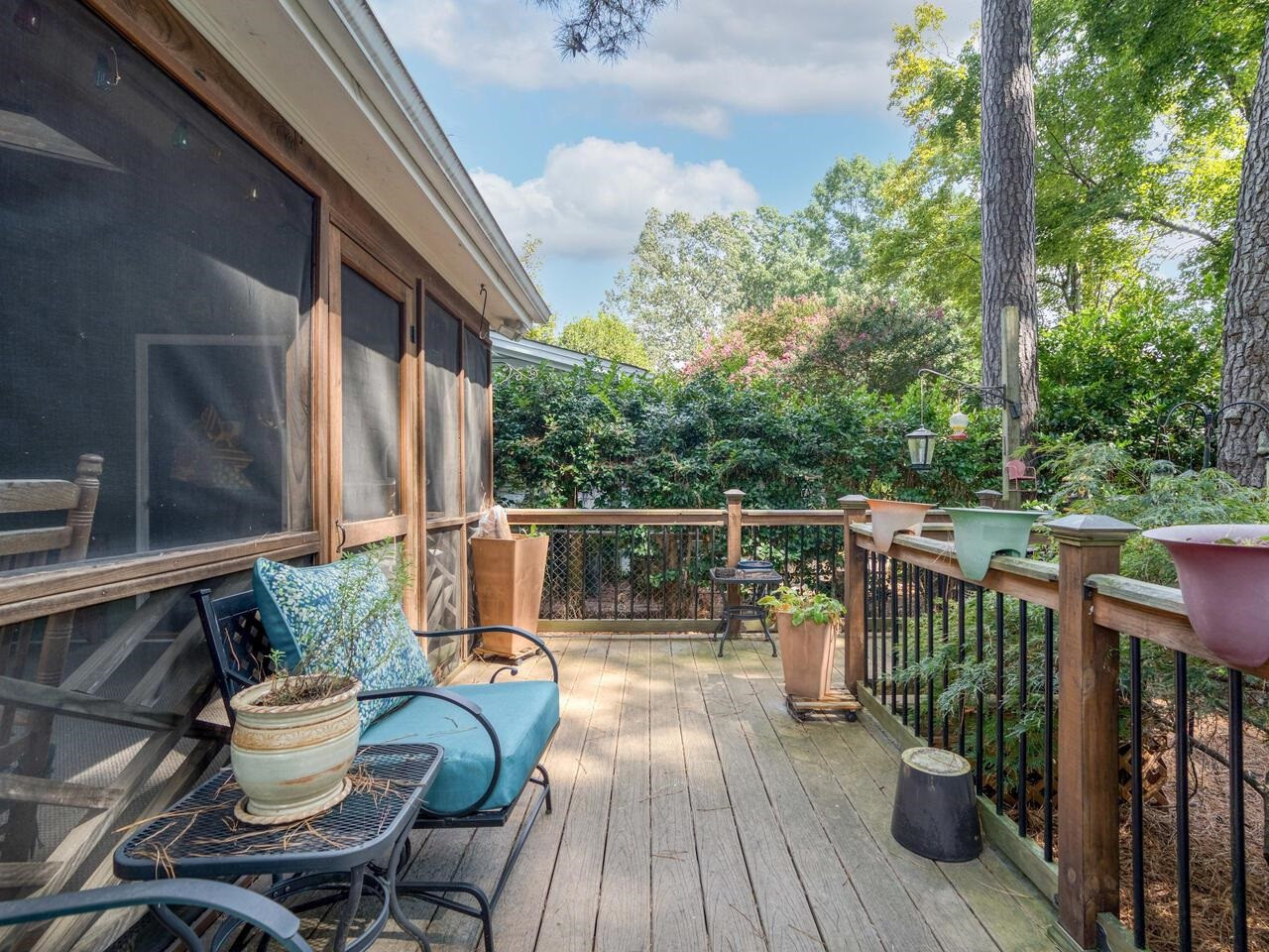 2603 Sawmill Road Raleigh, NC 27613 - Photo 39 of 53 a view of a balcony with chairs and wooden floor