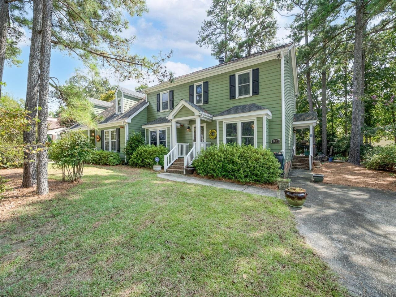 2603 Sawmill Road Raleigh, NC 27613 - Photo 4 of 53 a front view of a house with a yard