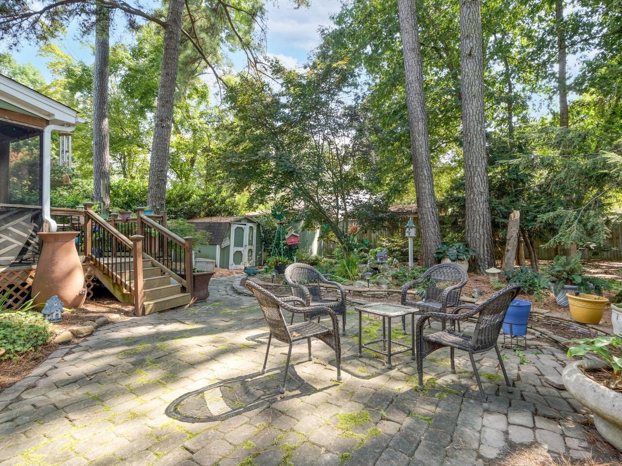 2603 Sawmill Road Raleigh, NC 27613 - Photo 45 of 53 a view of a chairs and tables in the patio