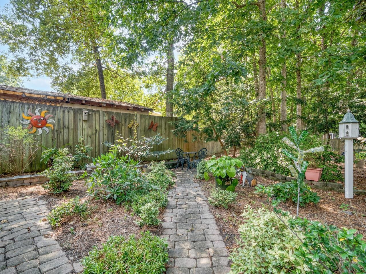 2603 Sawmill Road Raleigh, NC 27613 - Photo 47 of 53 a backyard of a house with lots of green space